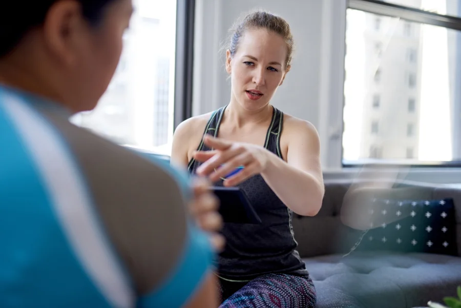 An image of a woman doing some physiotherapy at home after an operation